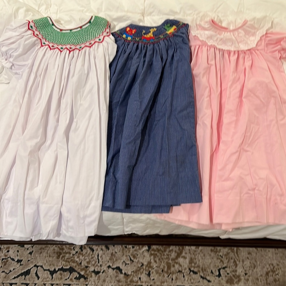 Smocked dresses sizes 3T (white), 2T(blue), 24mos(pink)